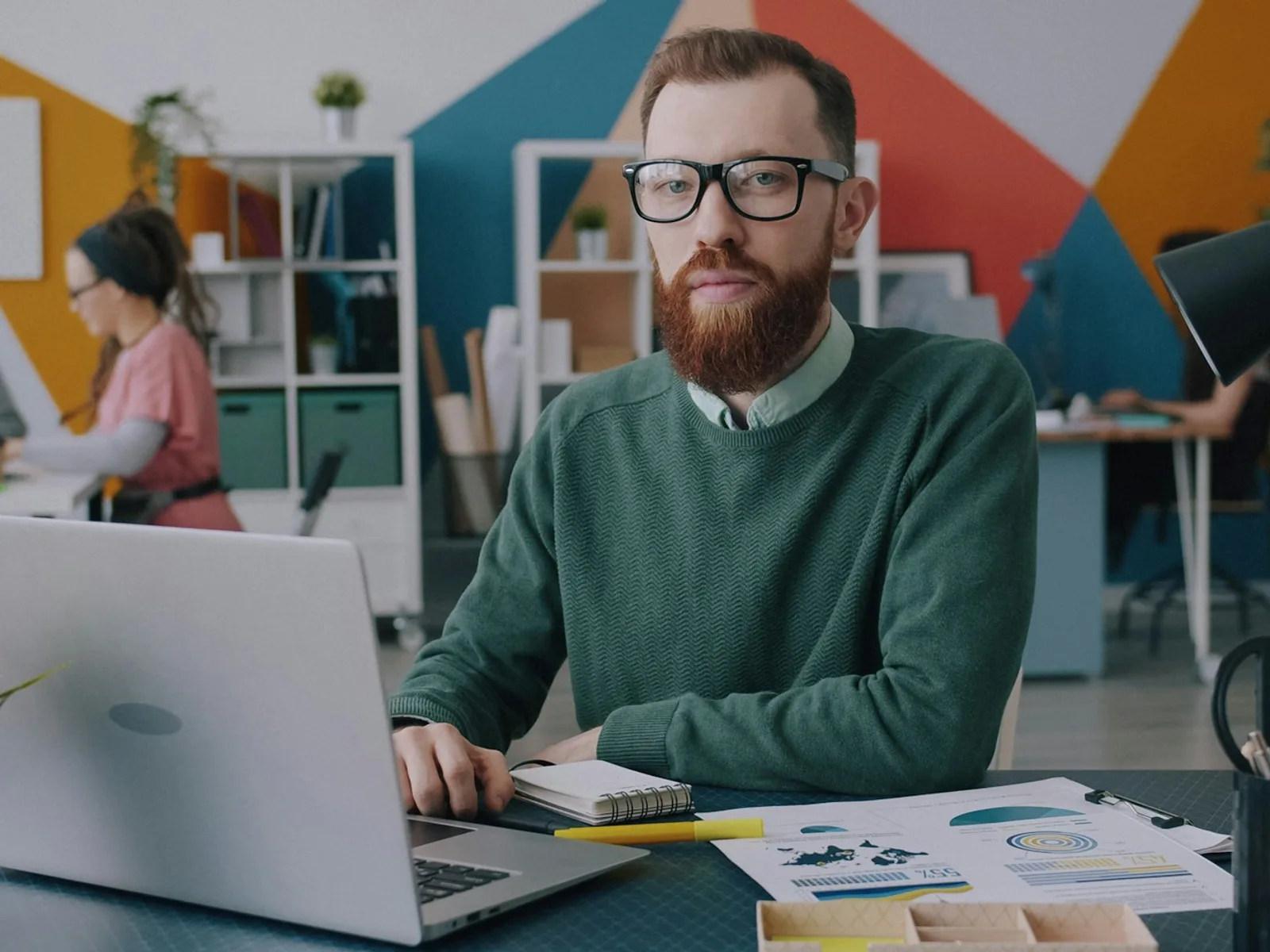 Person developing on a laptop in a work environment.